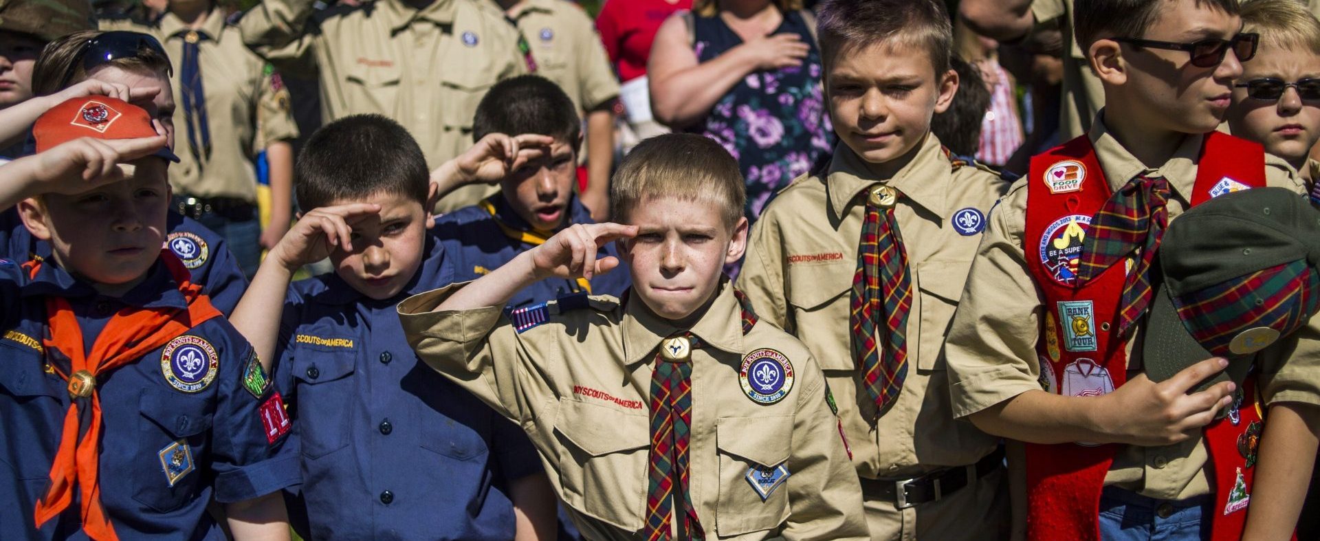 Scouts saluting