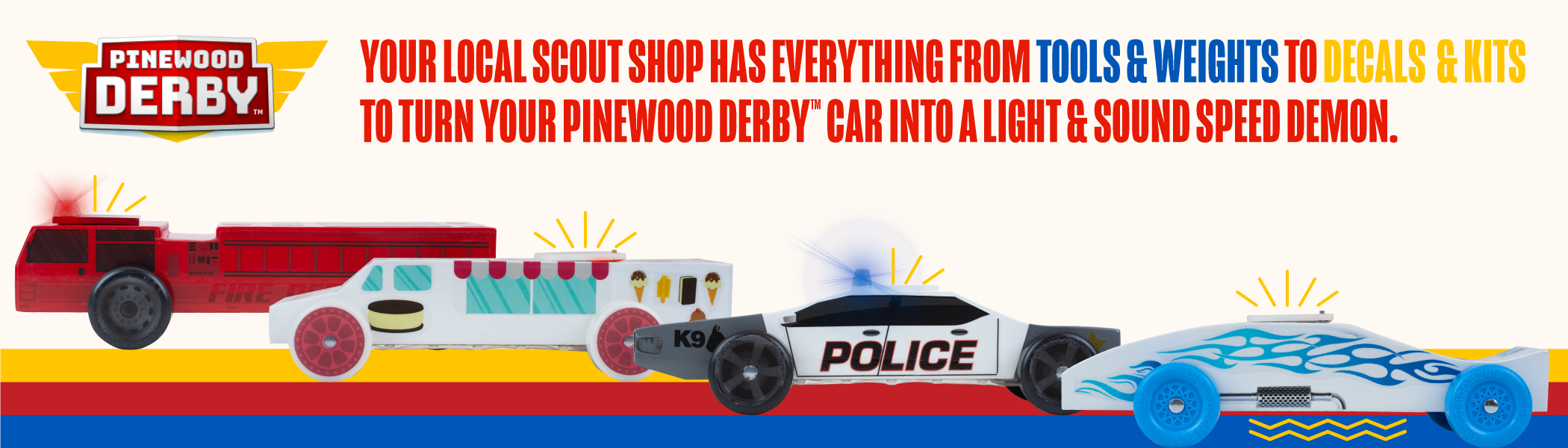 Four pinewood derby cars, decorated as a Fire Truck, Ice Cream Truck, Police Car, and Race Car, all with lights and/or sound effects installed.