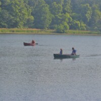 People in boats on a lake