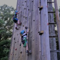 Kids climbing outdoor rock wall