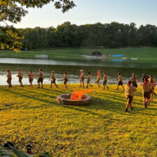 Campfire Program scouts around camp fire photo
