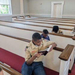 Scouts read sacred texts